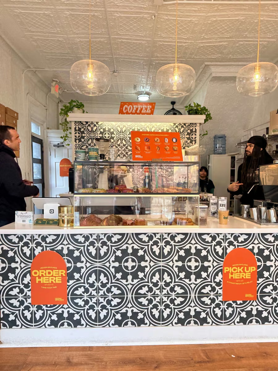 The tiled counter inside a Hidden Grounds café