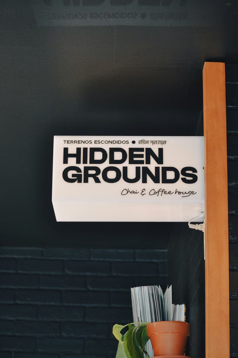 Hidden Grounds sign inside a café
