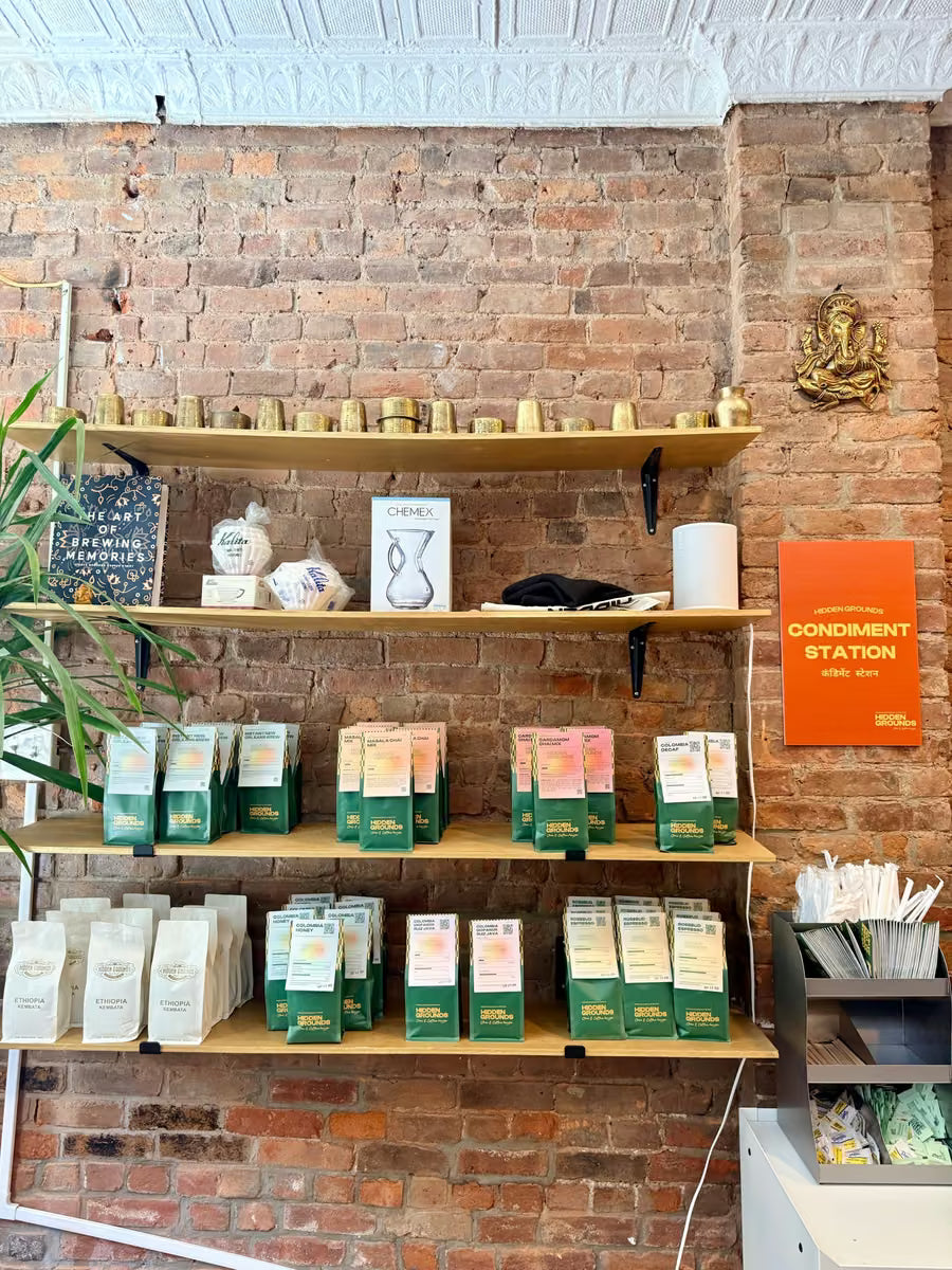 Coffee and chai bags displayed on a shelf inside Hidden Grounds